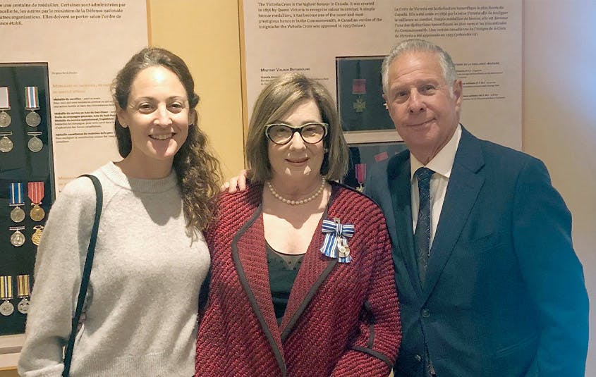 Pencils for Kids founder and President, Robin Mednick (centre), recipient of the Governor General’s Meritorious Service Medal, with daughter Sam and husband Ed